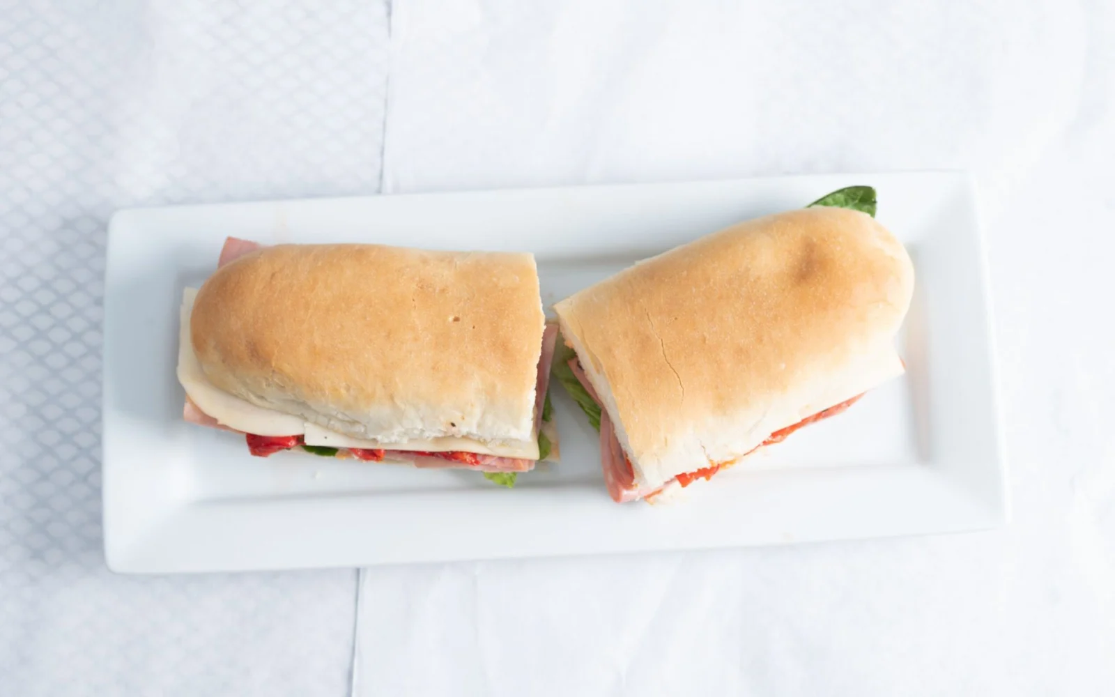 A freshly made sub, ready for a party tray